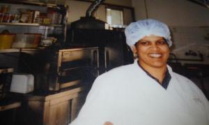 a man wearing a chefs hat in a kitchen at Grace Villa Bentota in Bentota