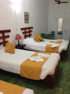 מיטה או מיטות בחדר ב-Hotel Don Robert