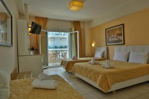 Posteľ alebo postele v izbe v ubytovaní Hotel Ilion