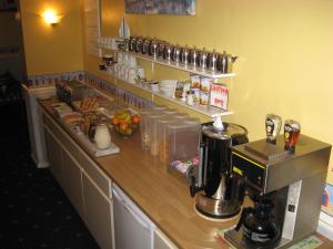 a kitchen with a counter with a coffee machine at Eastbourne Reymar in Eastbourne