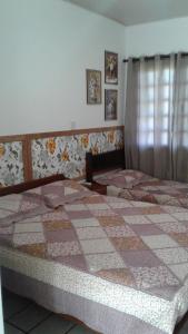 Postel nebo postele na pokoji v ubytování Residencial Três Irmas