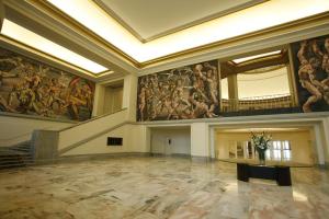 
a large room with a large painting on the wall at NH Gran Hotel Provincial in Mar del Plata
