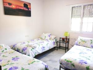 Postel nebo postele na pokoji v ubytování Villa La Jara