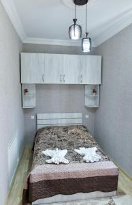 מיטה או מיטות בחדר ב-Bibi