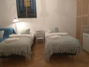 Posteľ alebo postele v izbe v ubytovaní Studio Iwicka