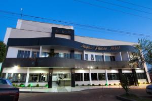 a large building with apolice office in front of it at Augusto Palace Hotel in Marabá