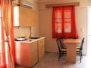 Kuchyňa alebo kuchynka v ubytovaní Happyland Hotel Apartments