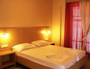 Posteľ alebo postele v izbe v ubytovaní Happyland Hotel Apartments