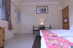 Postel nebo postele na pokoji v ubytování Zuo An Hostel