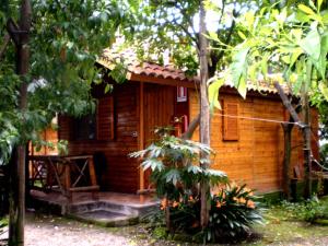 a wooden cabin in the middle of a forest at Residence Villaggio Verde in Sorrento