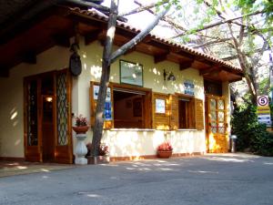 a building with a porch with a vase in front of it at Residence Villaggio Verde in Sorrento