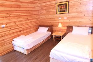 Postel nebo postele na pokoji v ubytování Zuo An Hostel