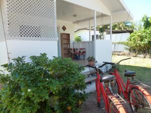 two bikes parked in front of a house at Farehani 2 in Avatoru