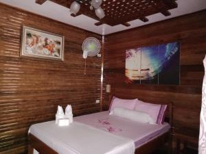 Postel nebo postele na pokoji v ubytování BING-VICE Tourist Inn
