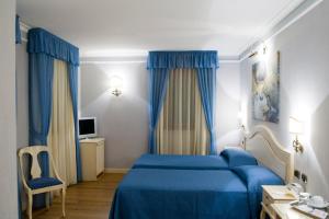 Postel nebo postele na pokoji v ubytování Albergo Da Nando