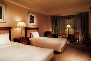 Cama ou camas em um quarto em Rihga Royal Hotel Tokyo