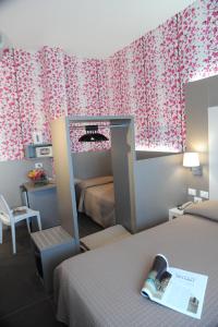 Postel nebo postele na pokoji v ubytování Hotel Astoria