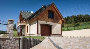 a house with a brown and white at Dom Na Stoku - Hillside Cottage Eliza in Szczawnica