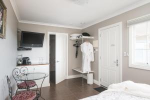 TV o dispositivi per l'intrattenimento presso The Ark Stanley Luxury Bed and Breakfast