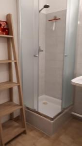 a shower with a glass door in a bathroom at Sète&Toi in Sète