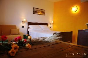 Postel nebo postele na pokoji v ubytování Agriturismo Essentia dimora rurale