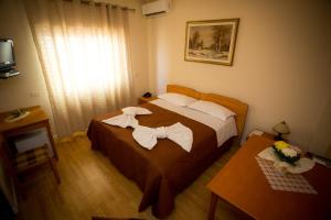 Uma cama ou camas num quarto em Kolping