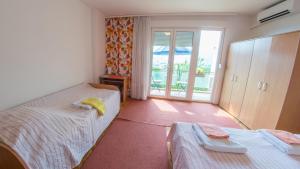 Postel nebo postele na pokoji v ubytování Guest House Agava