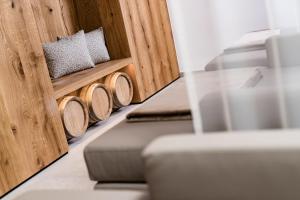 a row of pillows and cushions in a room at Hotel Plattenhof in Termeno