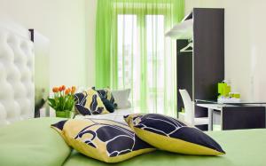 a bedroom with a bed with pillows on it at Sorrento Flats in Sorrento