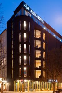 a large black building with a sign on it at Axel Hotel Berlin-Adults Only in Berlin