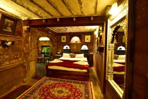 a bedroom with two beds and a rug in a room at The Arch Boutique Home stay in Jodhpur