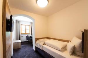 Postel nebo postele na pokoji v ubytování Hotel Haflhof