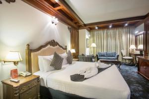Postel nebo postele na pokoji v ubytování Hotel Sarina