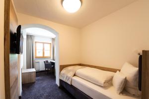 Postel nebo postele na pokoji v ubytování Hotel Haflhof