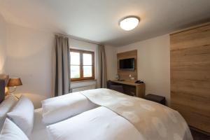 Postel nebo postele na pokoji v ubytování Hotel Haflhof