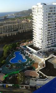 an aerial view of a large building with a marina at Adeje300, Playa Paraíso in Playa Paraiso