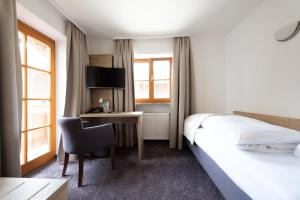 Postel nebo postele na pokoji v ubytování Hotel Haflhof