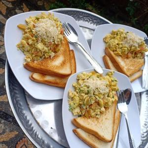 a plate of food with toast and vegetables on it at Kuwera Homestay in Nusa Penida