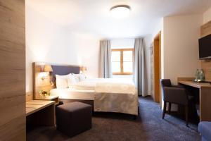 Postel nebo postele na pokoji v ubytování Hotel Haflhof