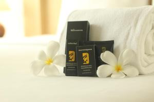 Кровать или кровати в номере Bansabai Sabaidee Service Apartment