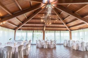 a banquet hall with white tables and chairs at Hotel Villa Maria in Crispiano +119 photos
