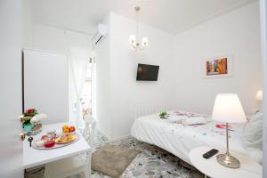 Posteľ alebo postele v izbe v ubytovaní Maison Ortigia