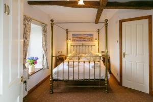 מיטה או מיטות בחדר ב-The Marton Arms