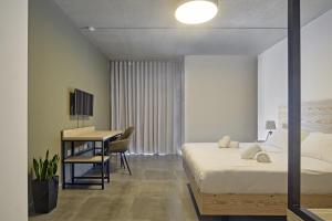 Postel nebo postele na pokoji v ubytování Mr Todd Hotel