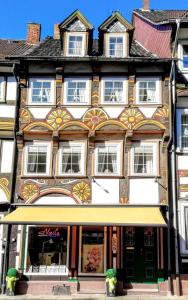 an old building with a store in front of it at Ferienwohnung Einbeck FeWo B Nolte in Einbeck