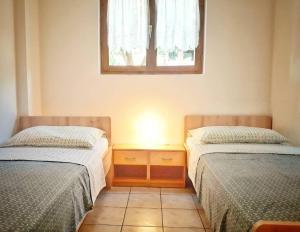 Posteľ alebo postele v izbe v ubytovaní Apartmani Mia
