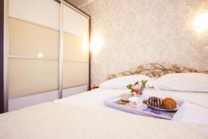 Postel nebo postele na pokoji v ubytování Apartments Paradise + 70 fotografií