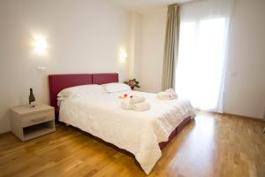 Postel nebo postele na pokoji v ubytování Hotel Arezzo ASC