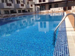 a large blue swimming pool in a building at Casa Zen in Puerto Calero