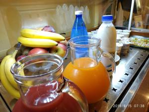 a bunch of fruit and bottles of juice on a counter at Nuovo Albergo in Chieti